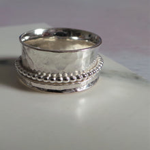 Solid silver hammered texture spinner ring